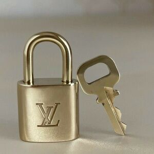 Louis Vuitton Gold Padlock and Key Set